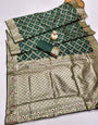 Demure Dark Green Soft Banarasi Silk Saree With Fairytale Blouse Piece