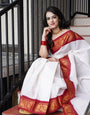 Dissemble Off White Soft Banarasi Silk Saree With Scrupulous Blouse Piece