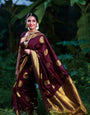 Scintillating Wine Soft Banarasi Silk Saree With Fancifull Blouse Piece