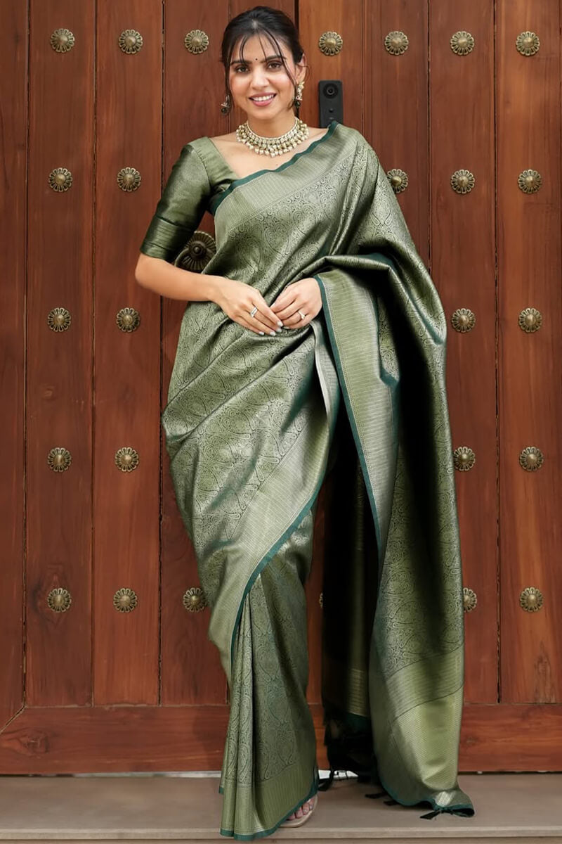 Sumptuous Dark Green Soft Silk Saree With Transcendent Blouse Piece