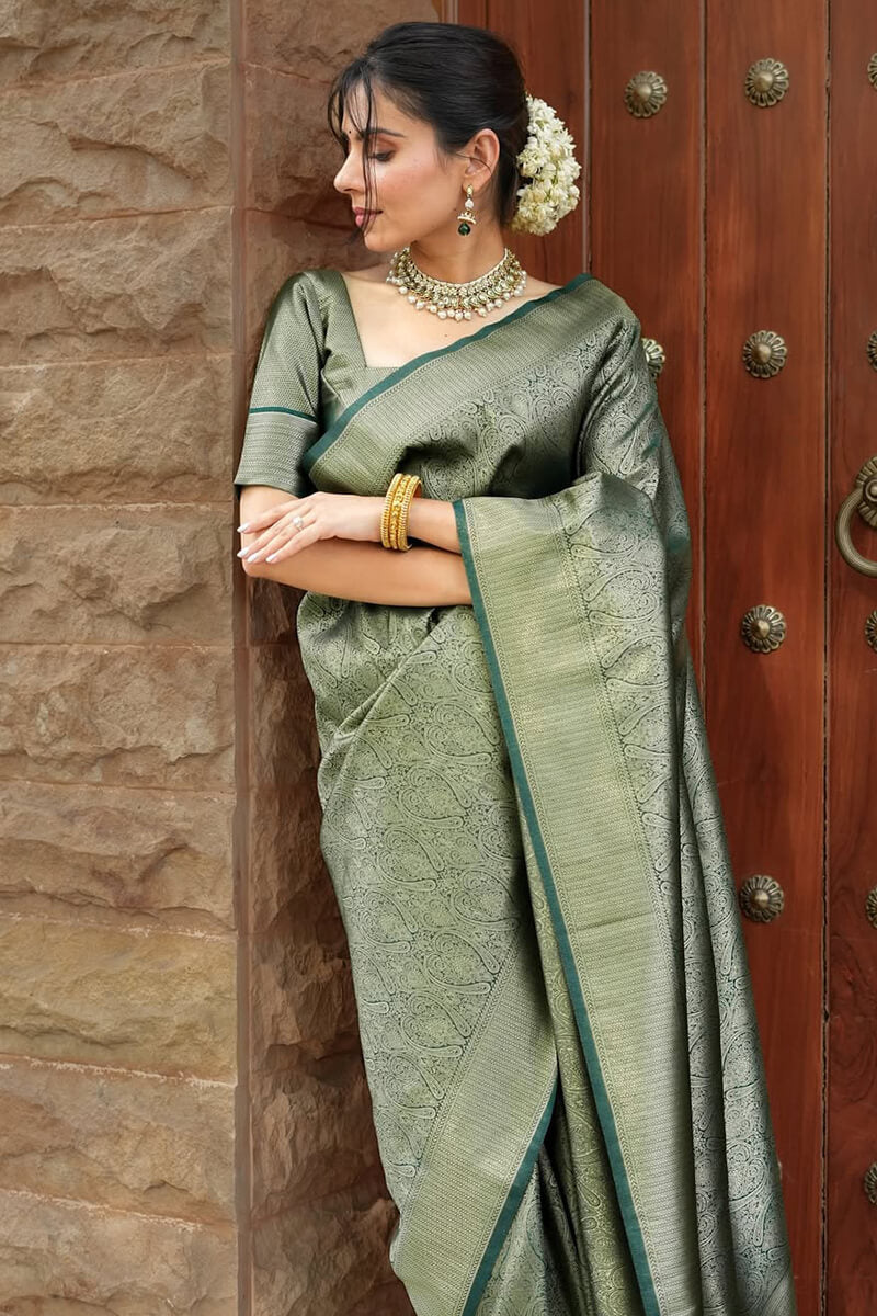 Sumptuous Dark Green Soft Silk Saree With Transcendent Blouse Piece