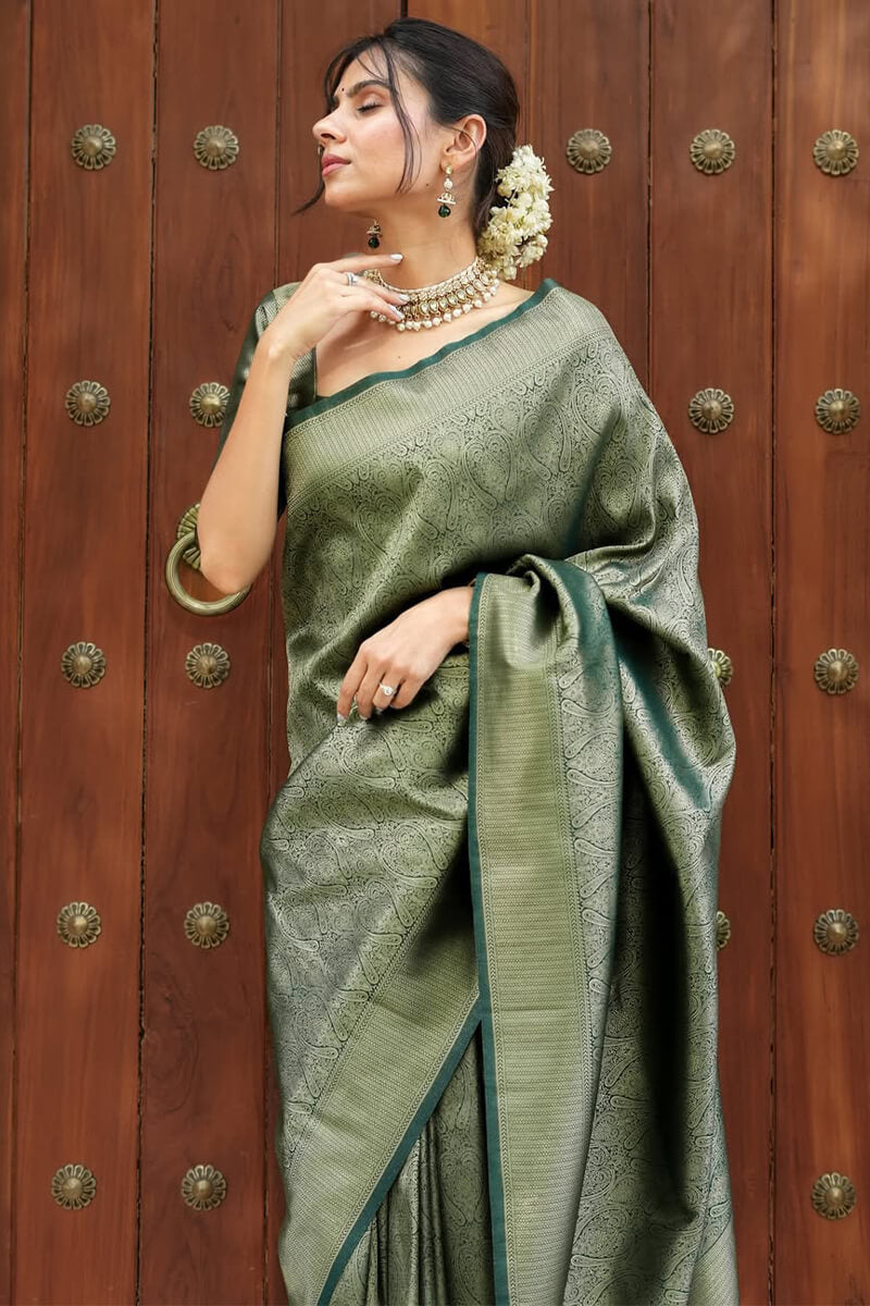 Sumptuous Dark Green Soft Silk Saree With Transcendent Blouse Piece