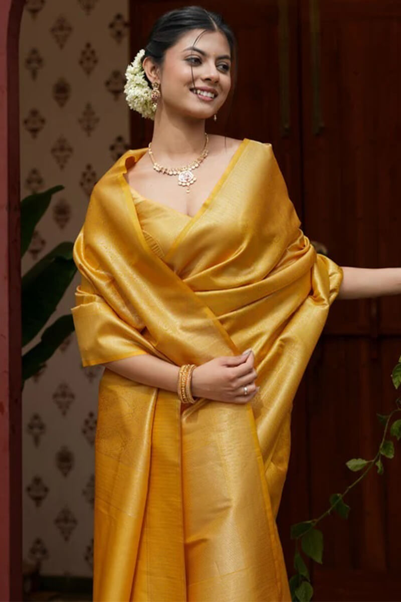 Invaluable Yellow Soft Silk Saree With Imaginative Blouse Piece