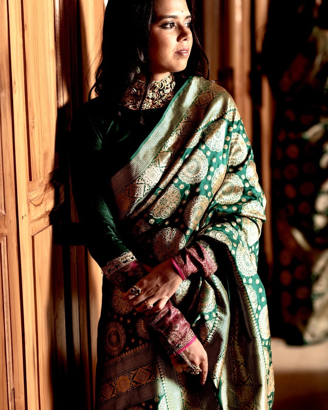 Gleaming Dark Green Soft Silk Saree With Gossamer Blouse Piece