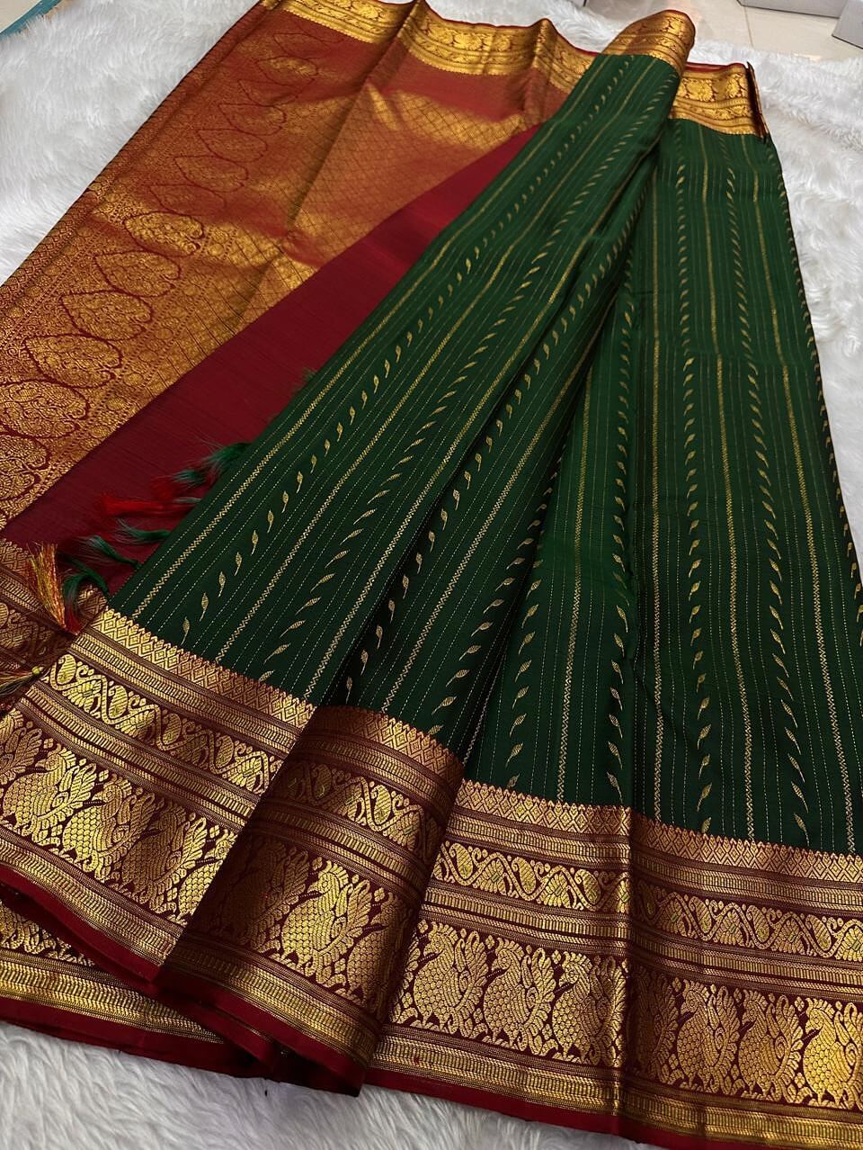 Gossamer Dark Green Soft Silk Saree With Eye-catching Blouse Piece