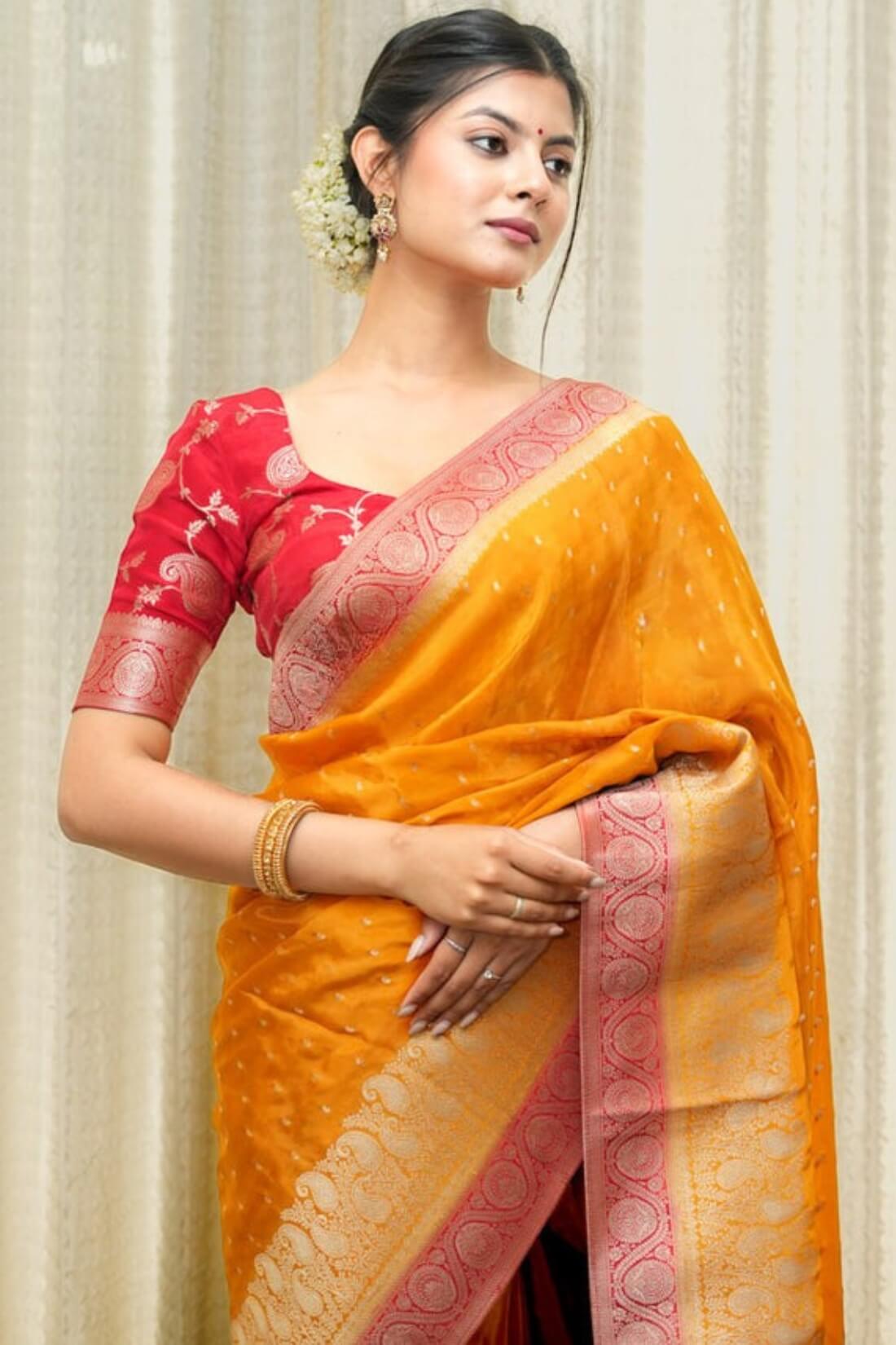 Tantalizing Orange Soft Silk Saree With Gossamer Blouse Piece