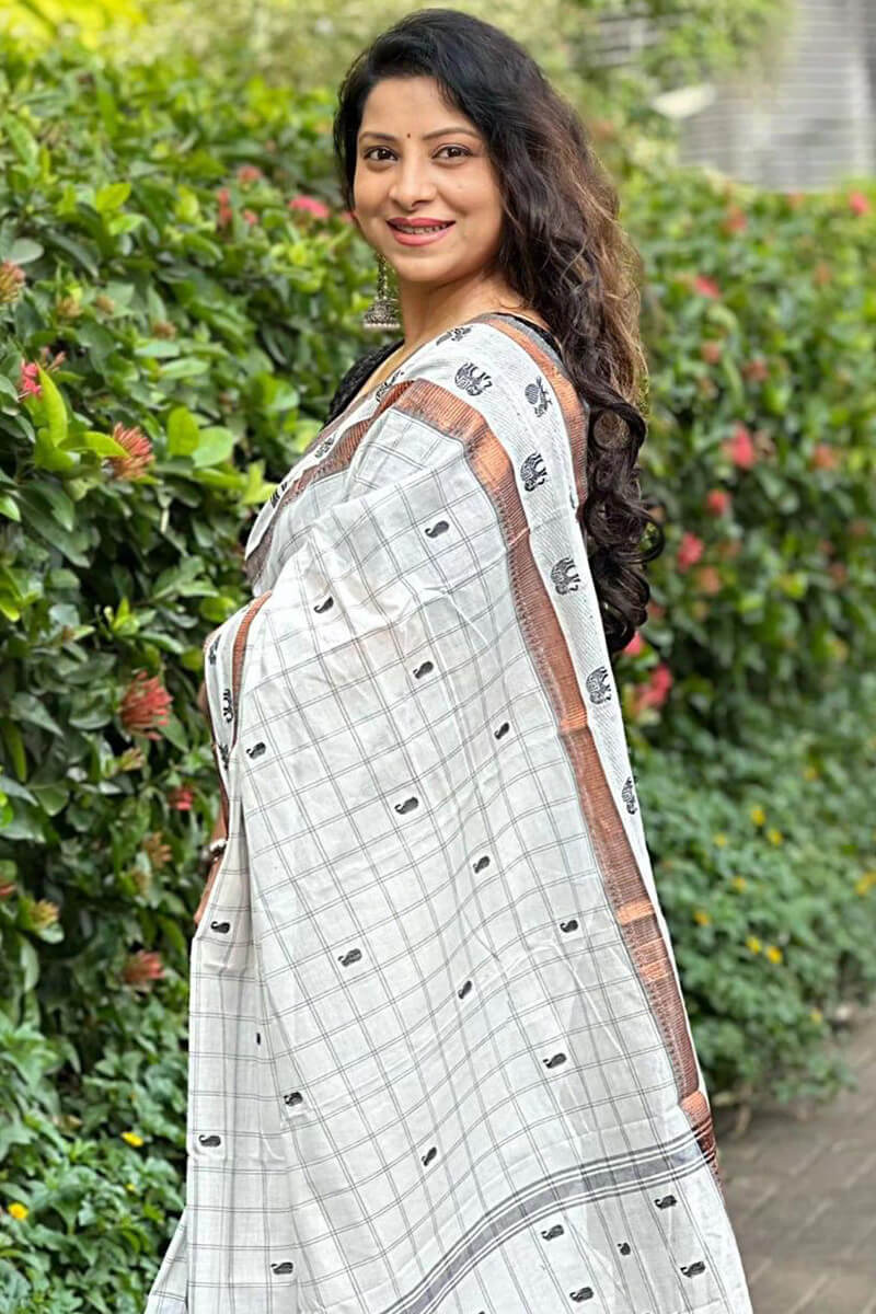 Diaphanous Off White Soft Silk Saree With Super classy Blouse Piece