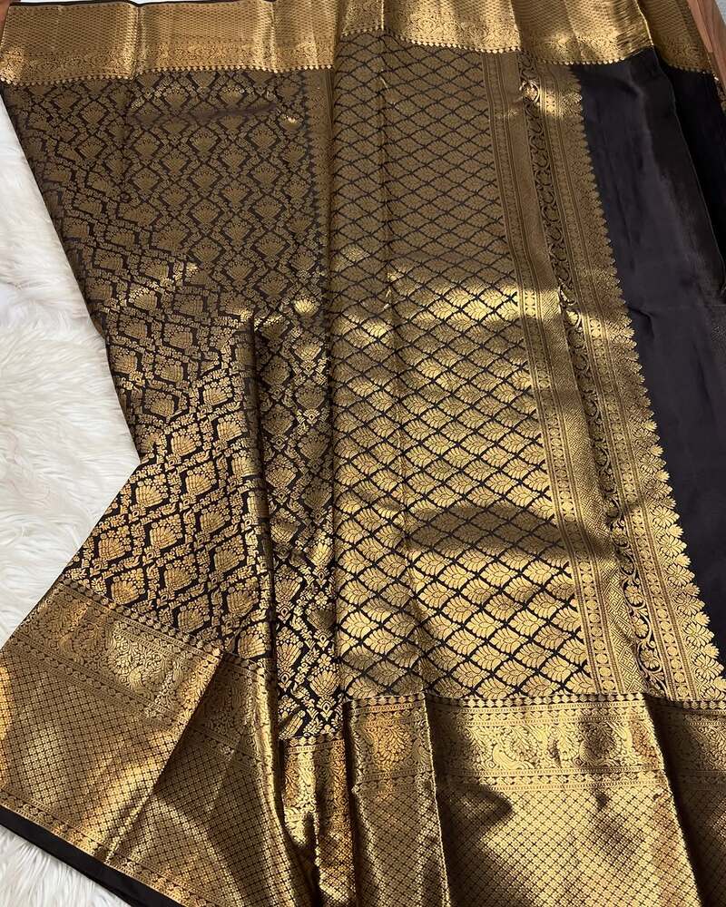 Adorning Black Soft Banarasi Silk Saree With Fantabulous Blouse Piece