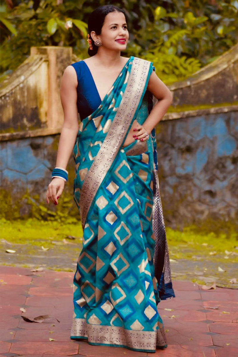 Sizzling Firozi Soft Silk Saree With Inspiring Blouse Piece