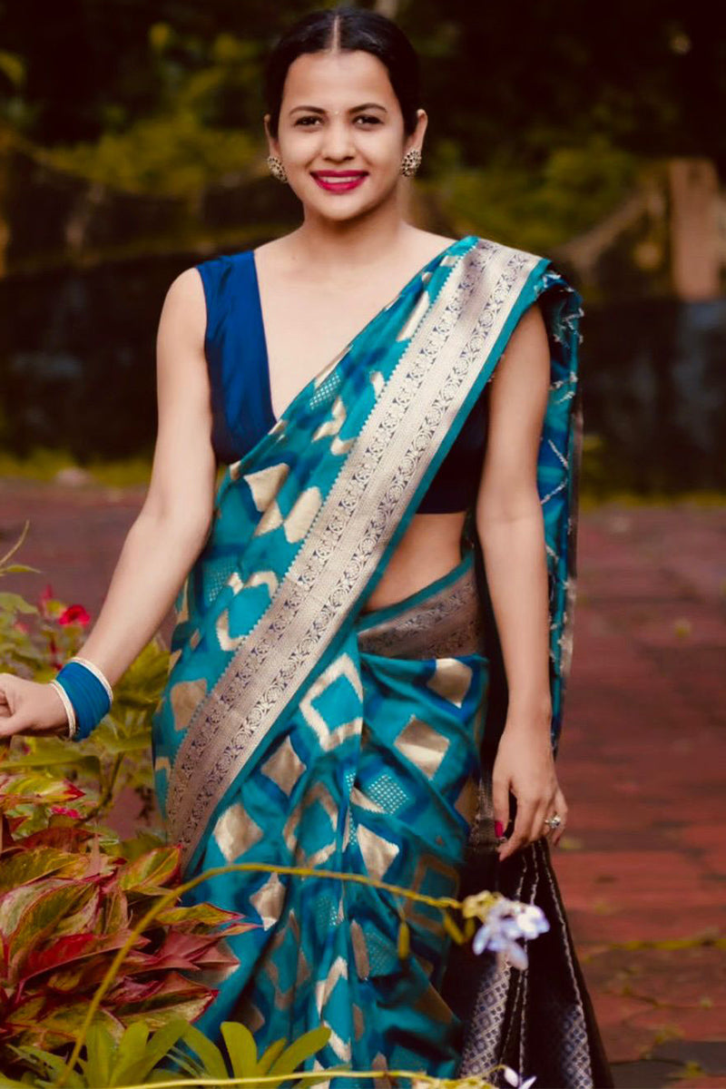 Sizzling Firozi Soft Silk Saree With Inspiring Blouse Piece