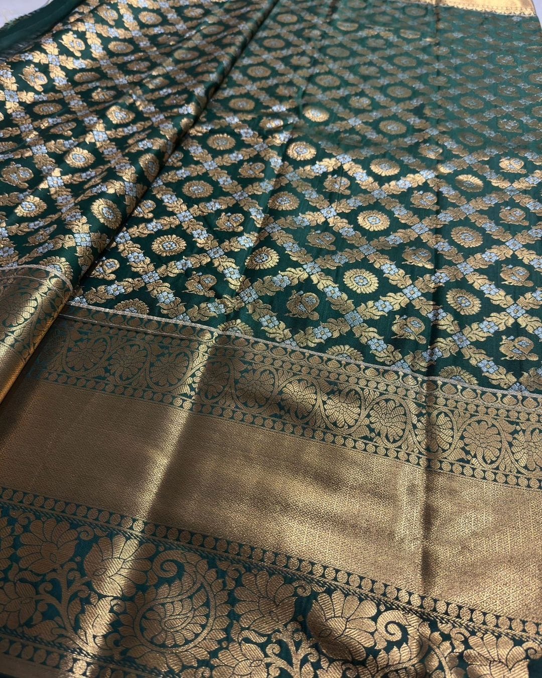 Hypnotic Dark Green Soft Silk Saree With Prettiest Blouse Piece