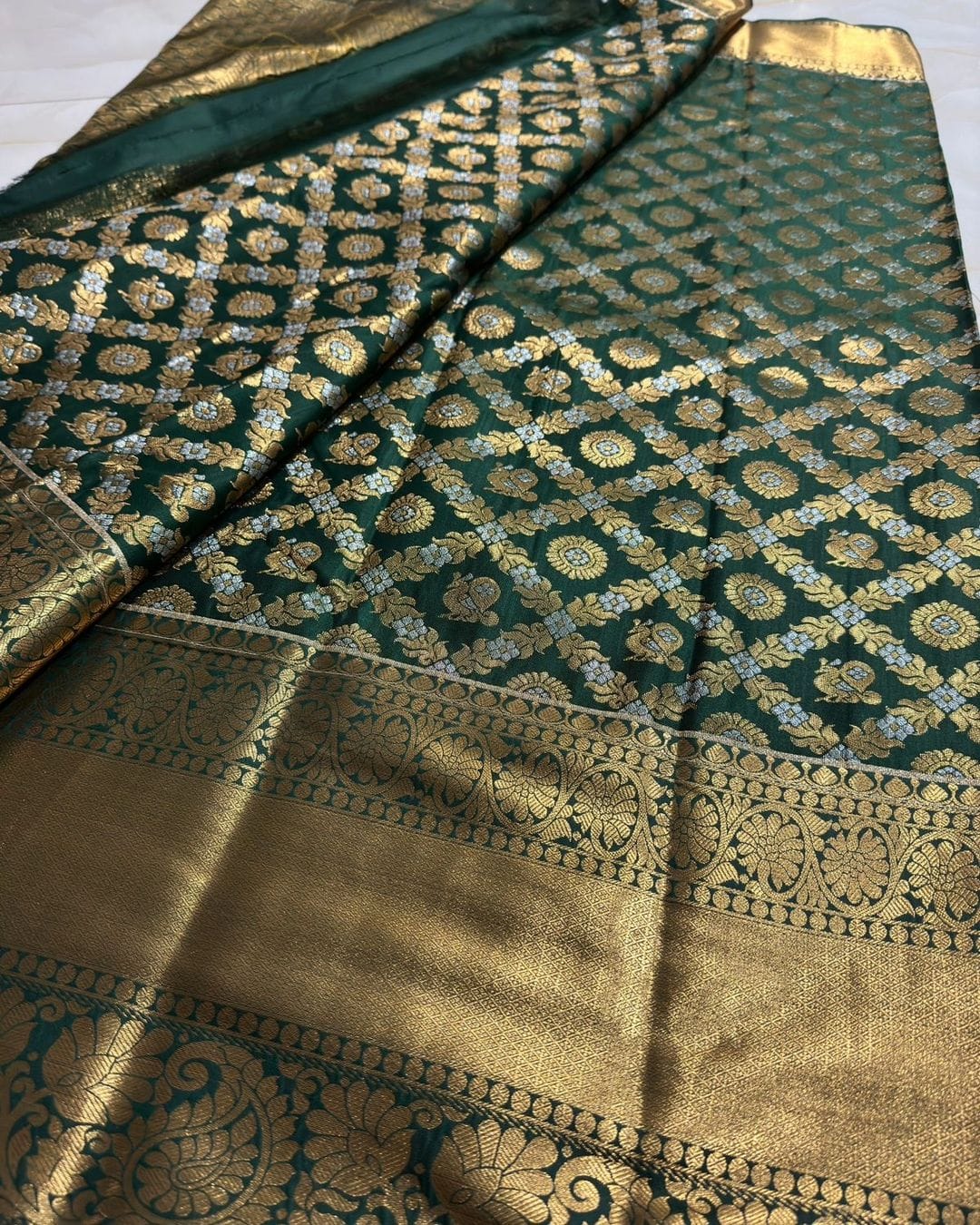 Hypnotic Dark Green Soft Silk Saree With Prettiest Blouse Piece