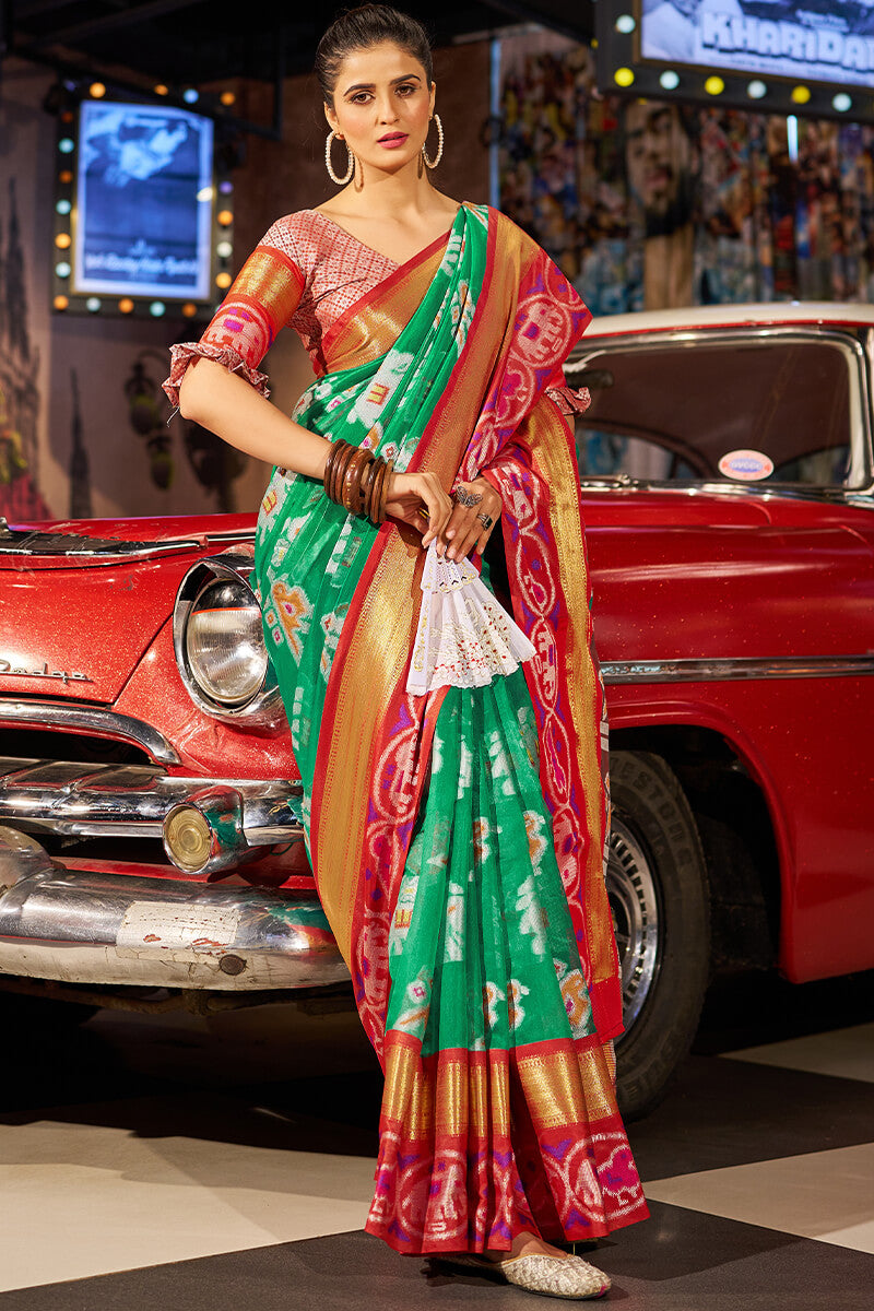 Exuberant Green Patola Silk Saree with Redolent Blouse Piece