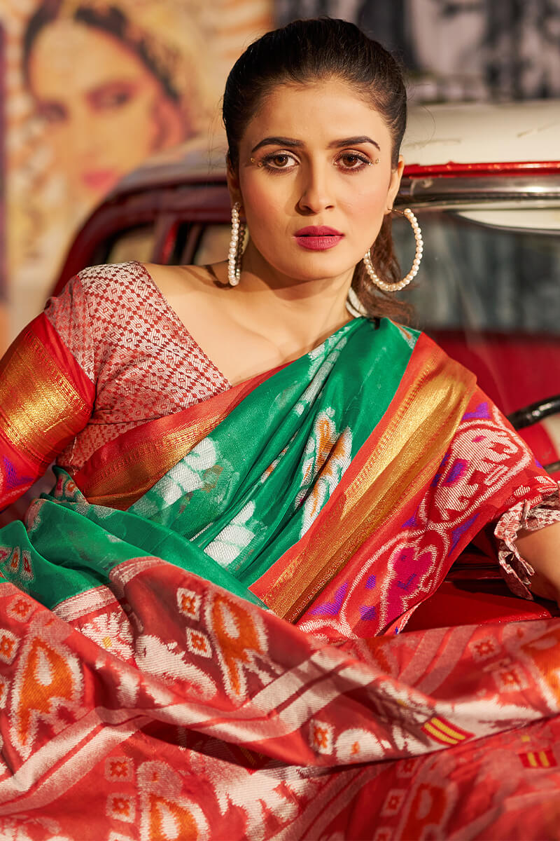 Exuberant Green Patola Silk Saree with Redolent Blouse Piece