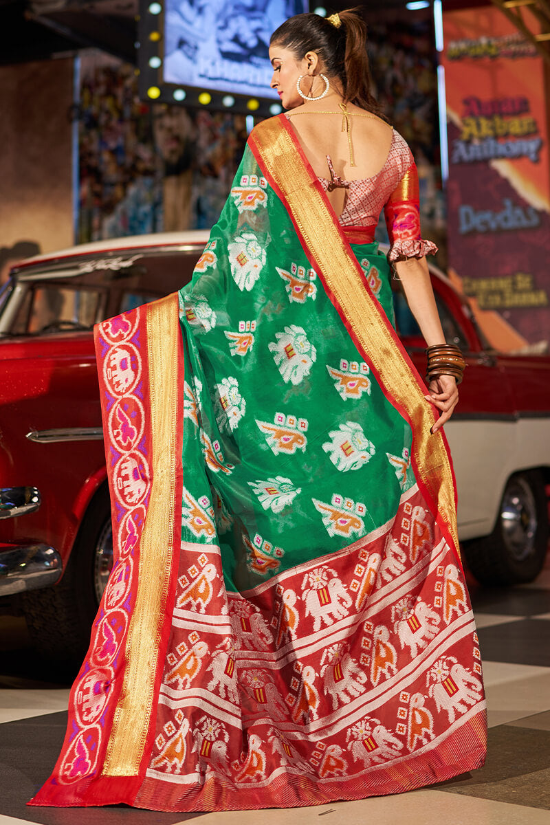 Exuberant Green Patola Silk Saree with Redolent Blouse Piece