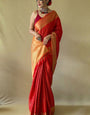 Embrocation Red Patola Silk Saree with Beleaguer Blouse Piece