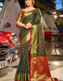 Moiety Dark Green Patola Silk Saree with Tempting Blouse Piece