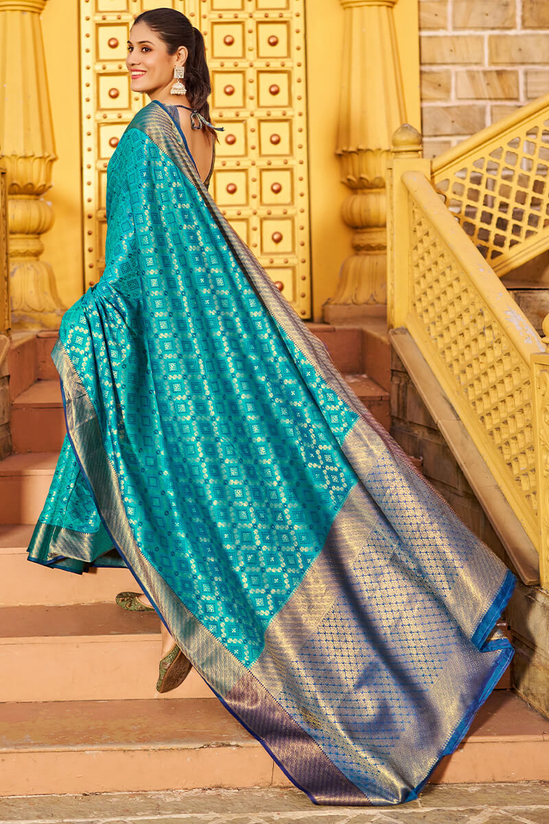 Groovy Firozi Patola Silk Saree with Dazzling Blouse Piece