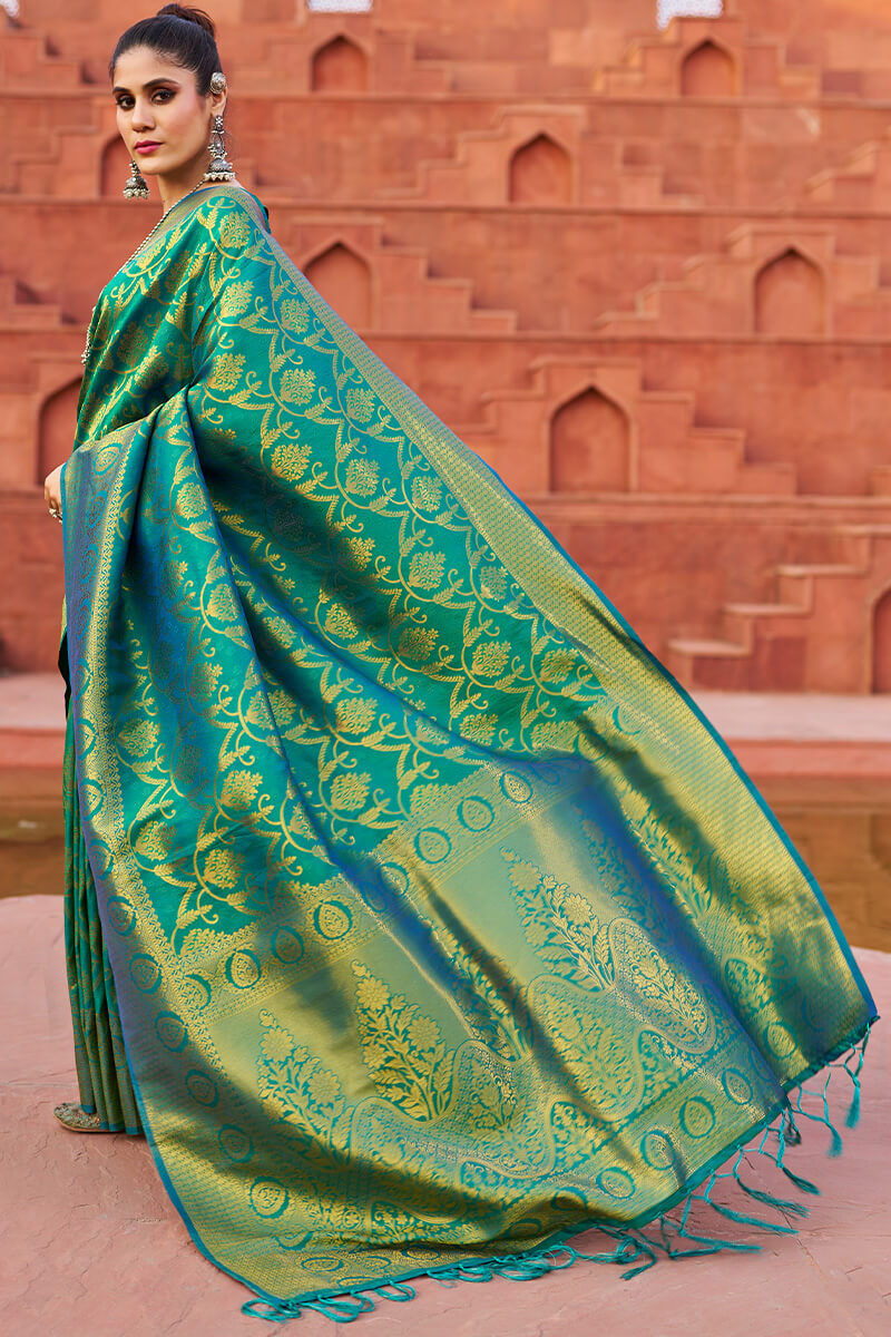 Desuetude Rama Banarasi Silk Saree With Gossamer Blouse Piece