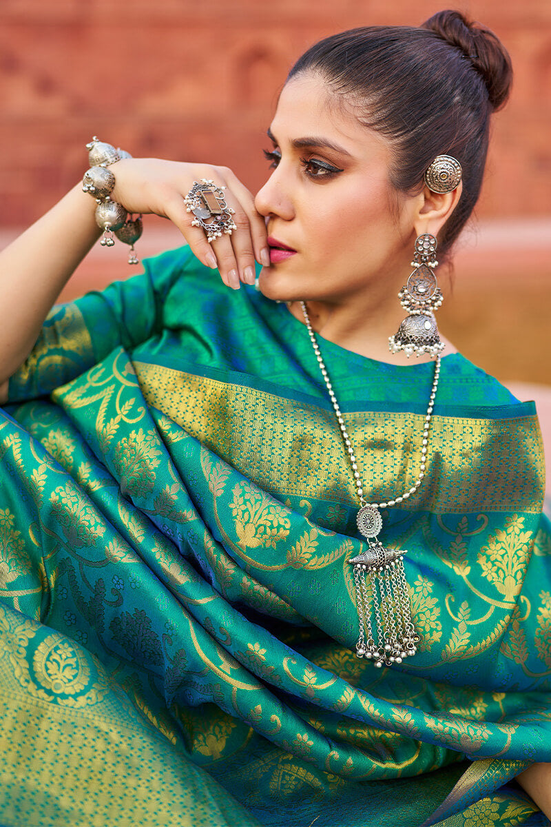 Desuetude Rama Banarasi Silk Saree With Gossamer Blouse Piece