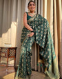 Tempting Dark Green Soft Silk Saree With Rhapsody Blouse Piece