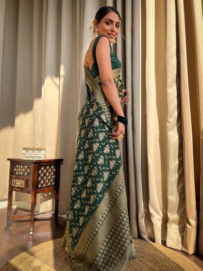 Tempting Dark Green Soft Silk Saree With Rhapsody Blouse Piece