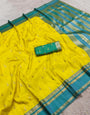 A glam Yellow Pure Zari Weaving Banarasi Silk Saree With Eloquence Blouse Piece