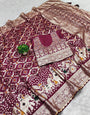 A glam Wine Soft Banarasi Silk Saree With Seraglio Blouse Piece