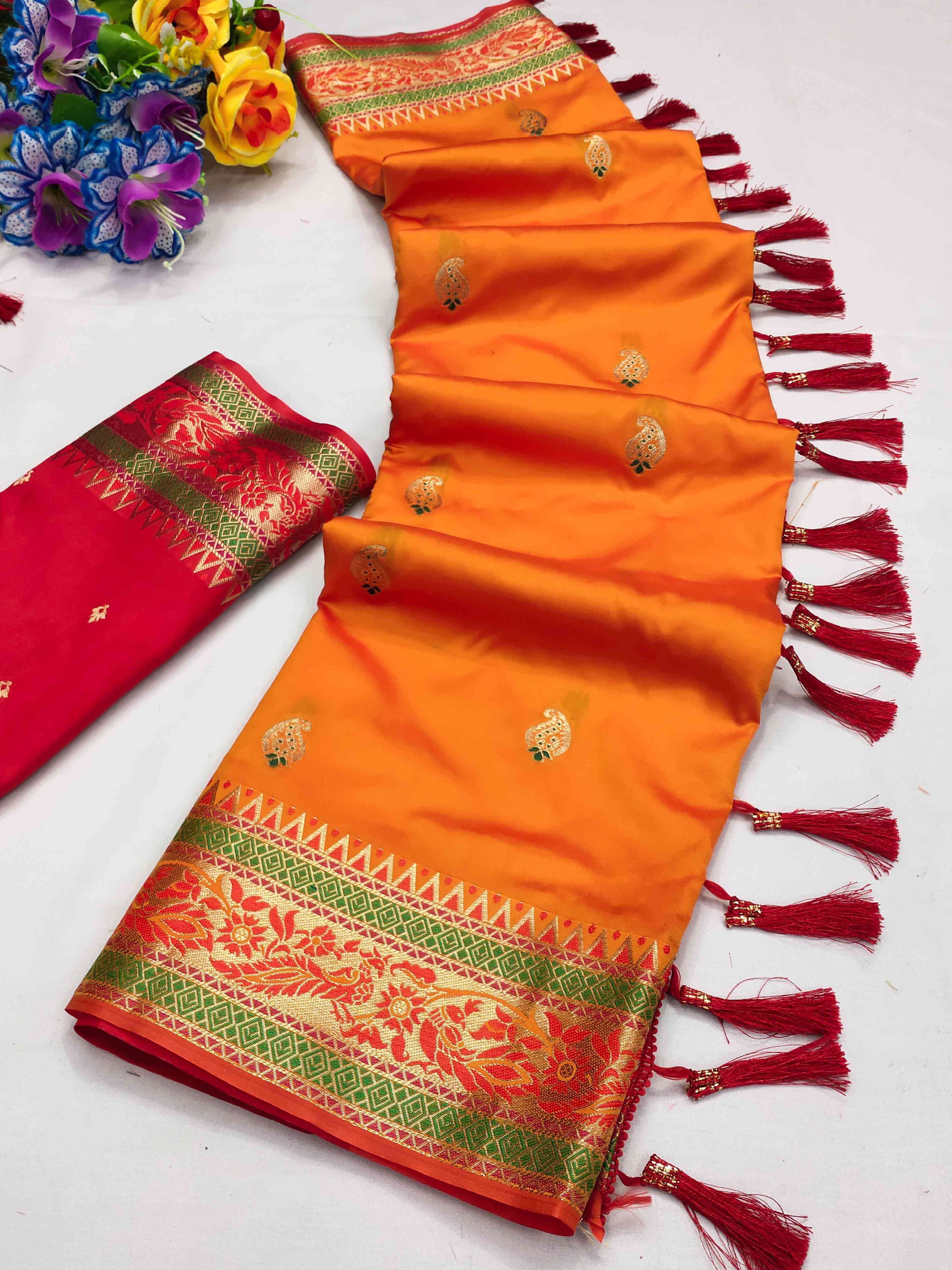 A glam Orange Soft Banarasi Silk Saree With Seraphic Blouse Piece