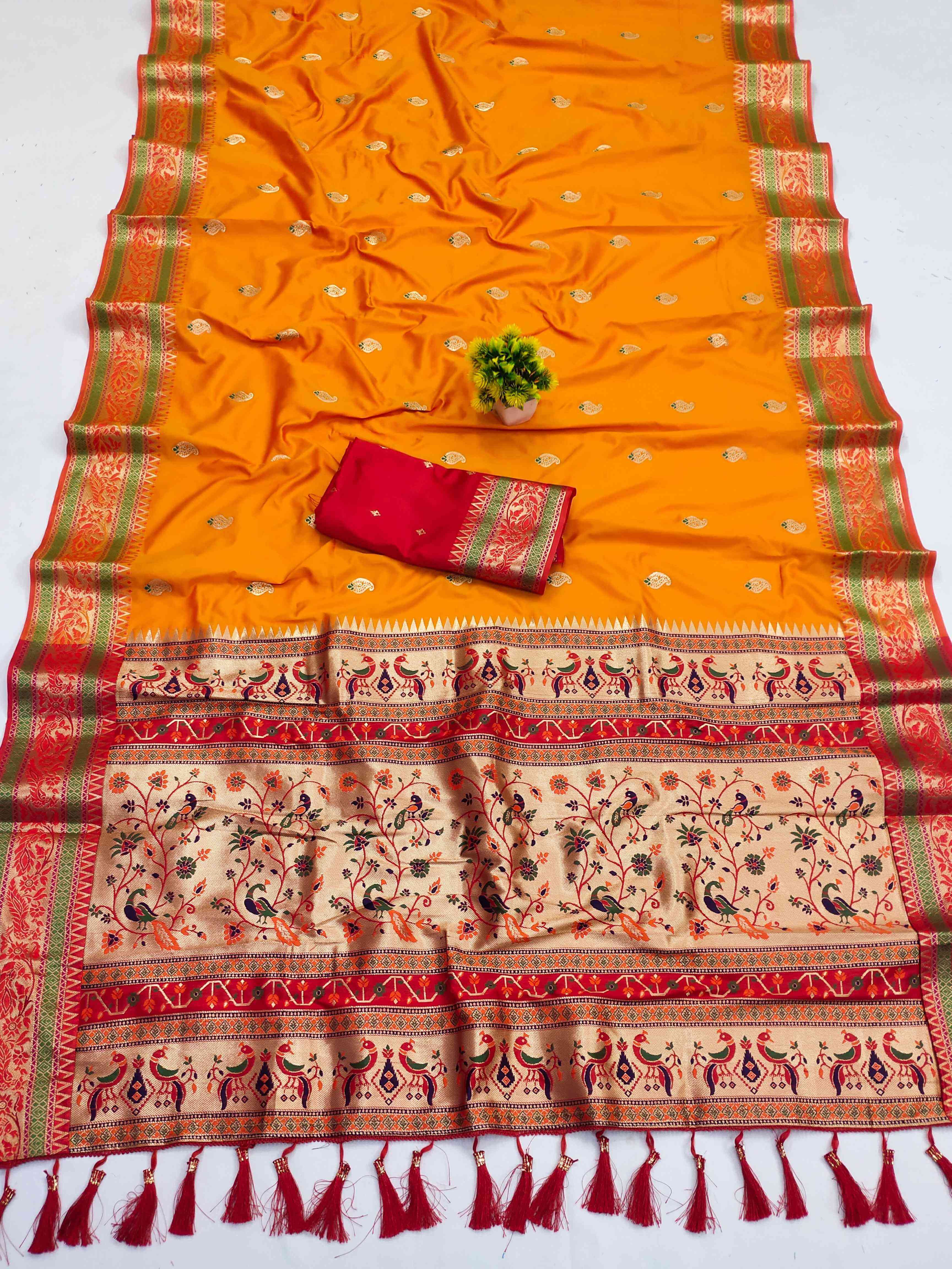 A glam Orange Soft Banarasi Silk Saree With Seraphic Blouse Piece