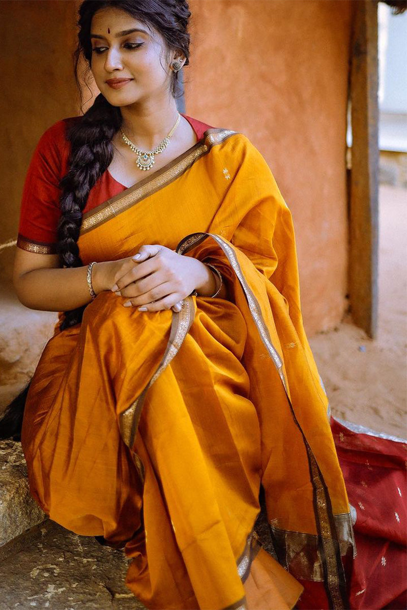 Smashing Yellow Cotton Silk Saree With Glamorous Blouse Piece