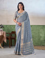 Mesmerising Grey Zari Weaving Linen Silk Saree With Blooming Blouse Piece
