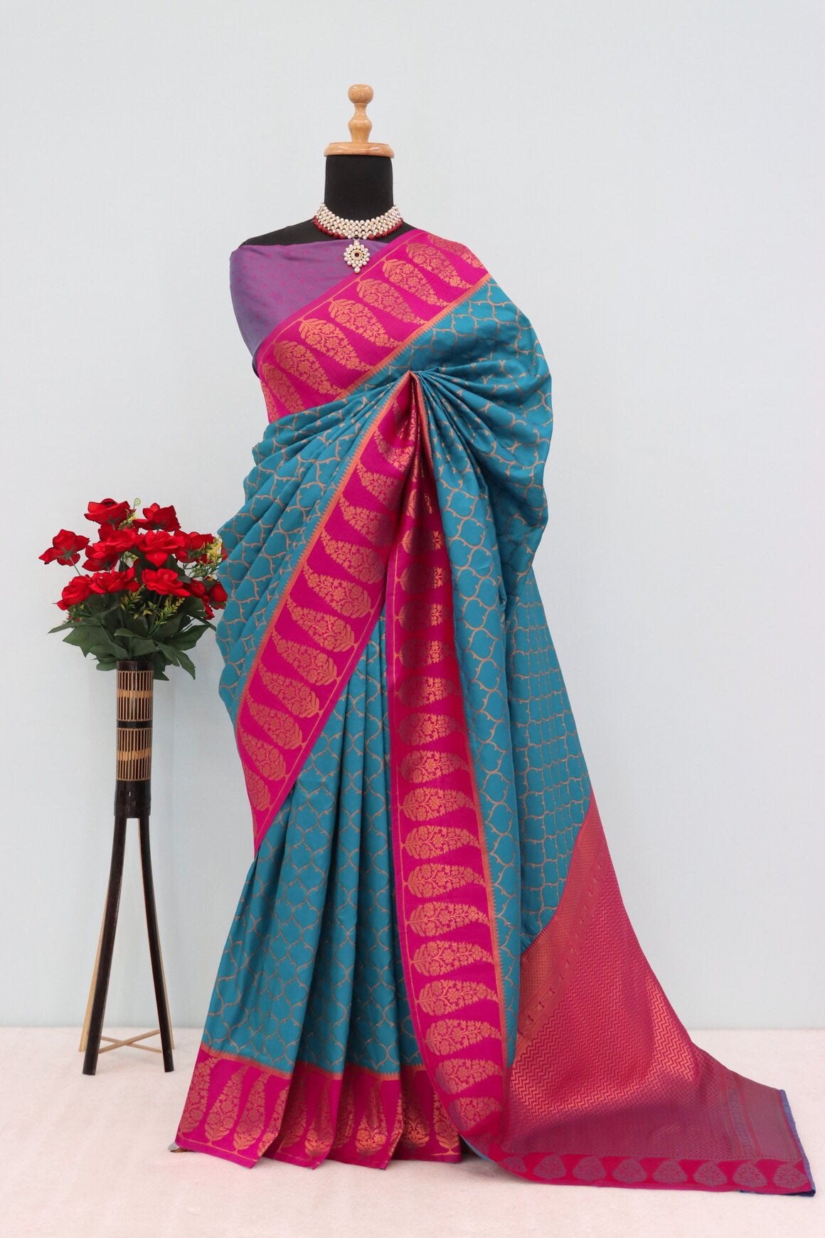 Nebula Rama Soft Banarasi Silk Saree With Winsome Blouse Piece
