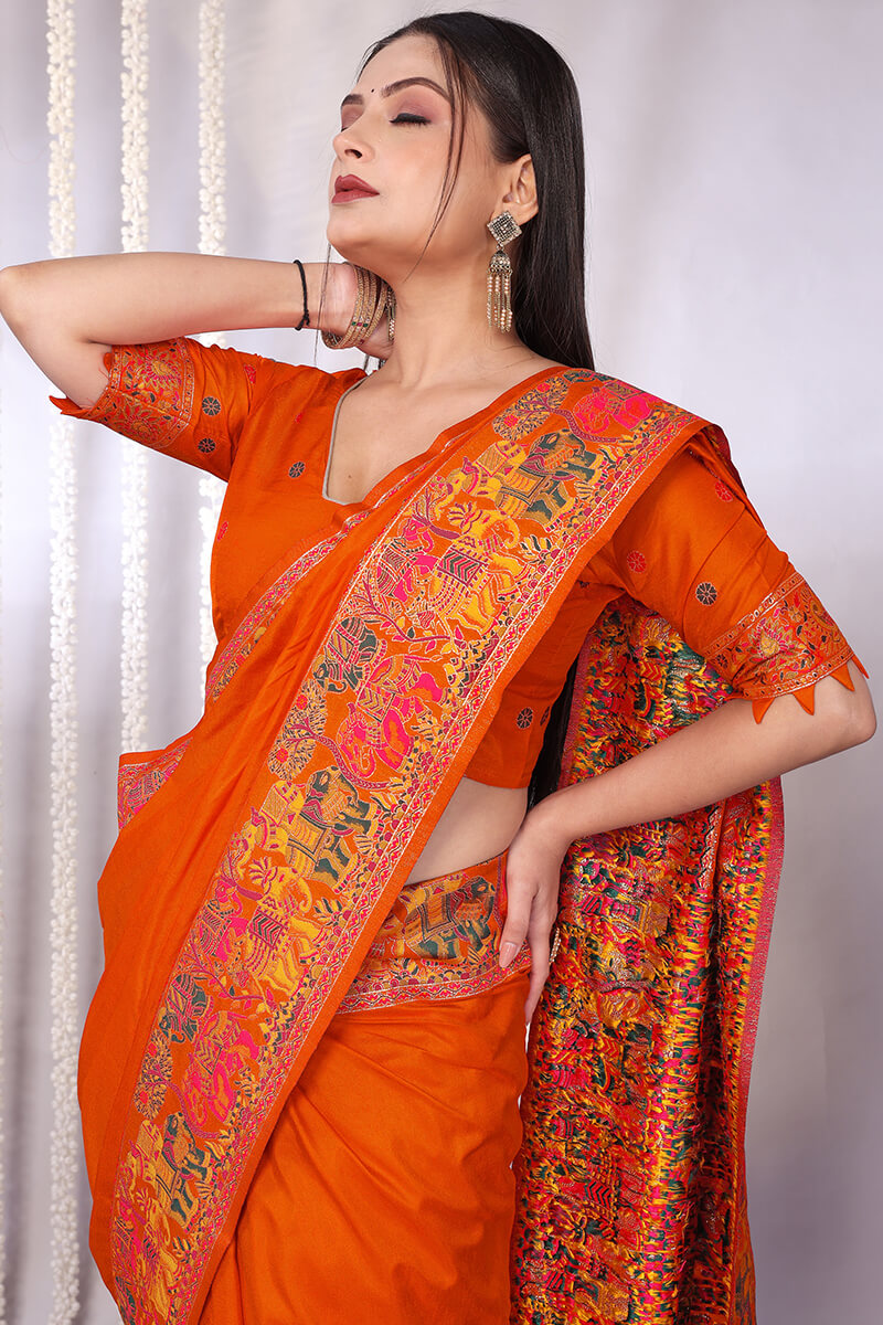 Enchanting Orange Pashmina Saree With Winsome Blouse Piece