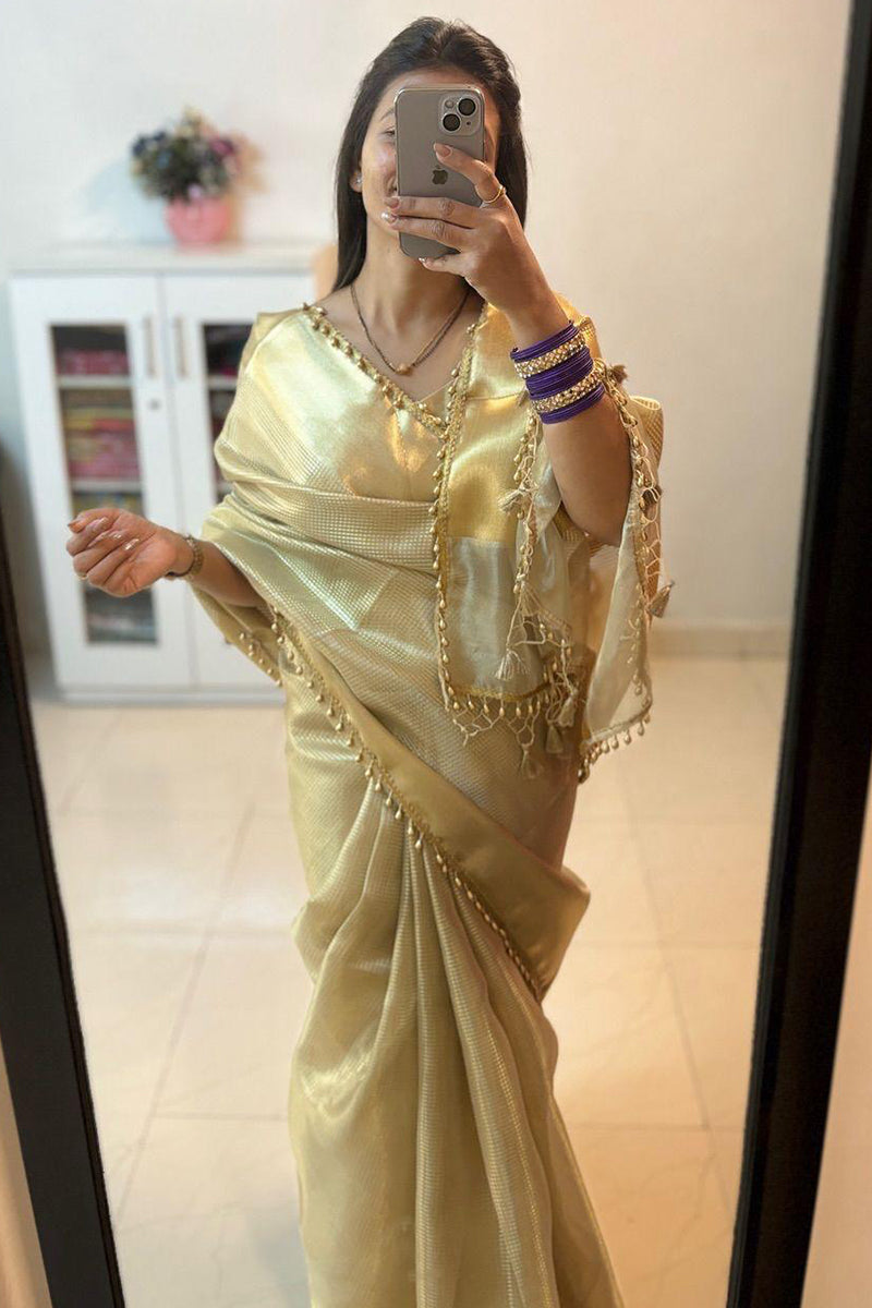 Bewitching Golden Soft Tissue Silk Saree With Gossamer Blouse Piece