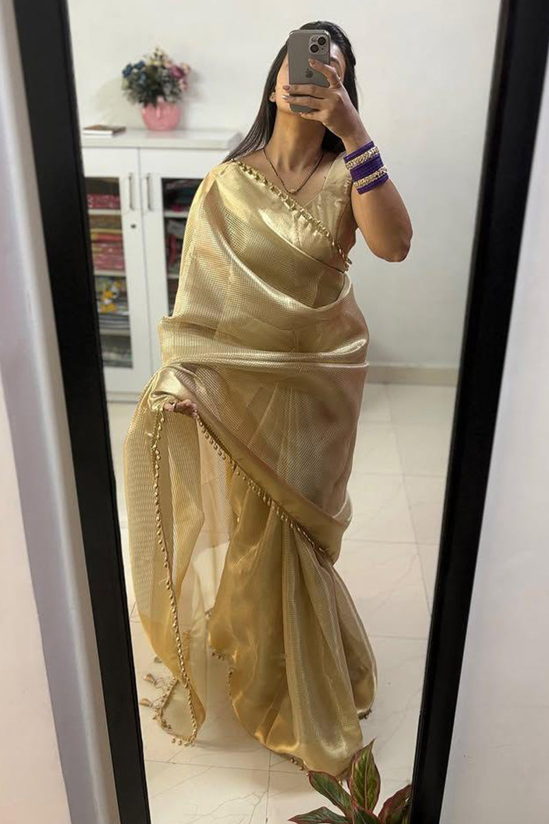 Bewitching Golden Soft Tissue Silk Saree With Gossamer Blouse Piece