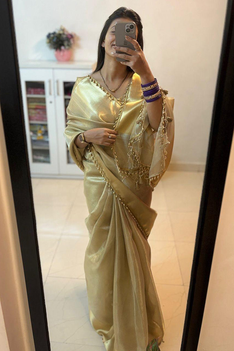 Bewitching Golden Soft Tissue Silk Saree With Gossamer Blouse Piece