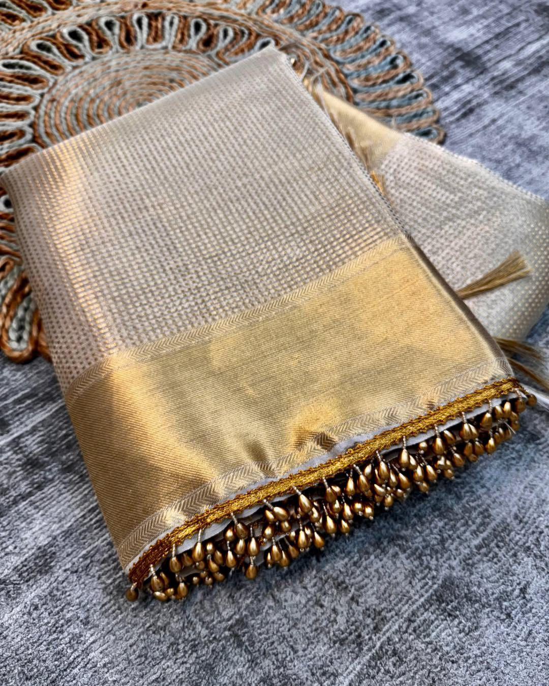 Bewitching Golden Soft Tissue Silk Saree With Gossamer Blouse Piece