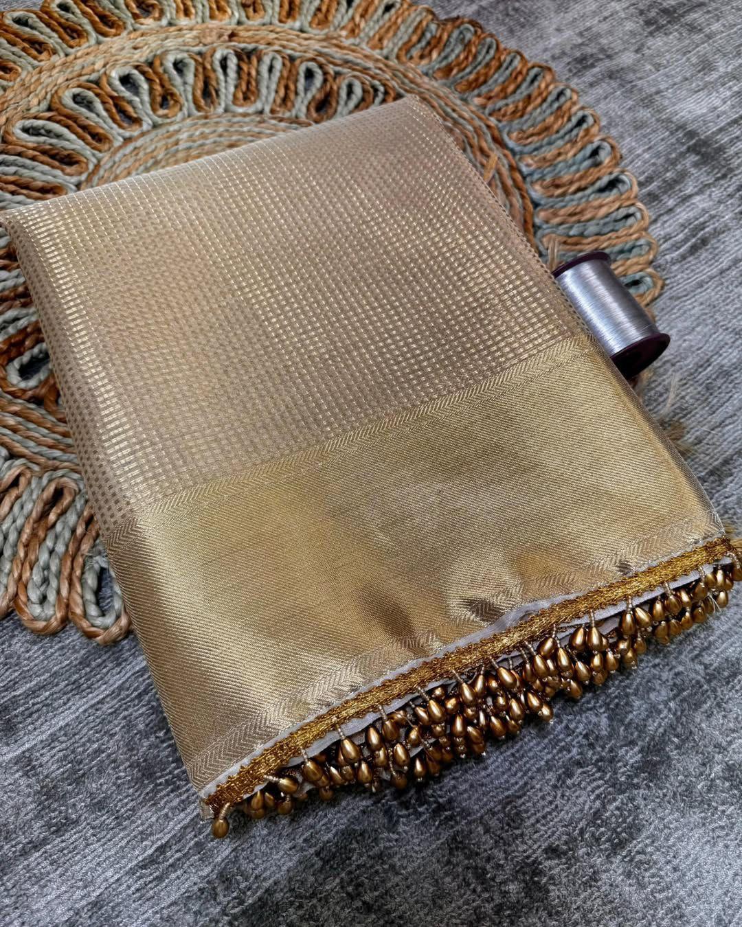 Bewitching Golden Soft Tissue Silk Saree With Gossamer Blouse Piece