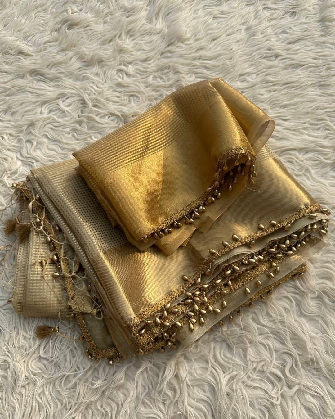 Bewitching Golden Soft Tissue Silk Saree With Gossamer Blouse Piece