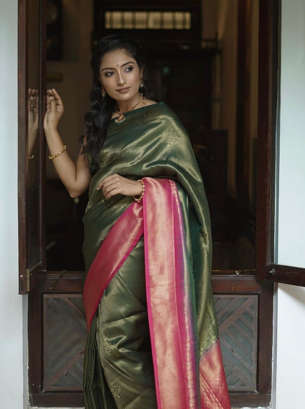 Extraordinary Dark Green Soft Silk Saree With Diaphanous Blouse Piece