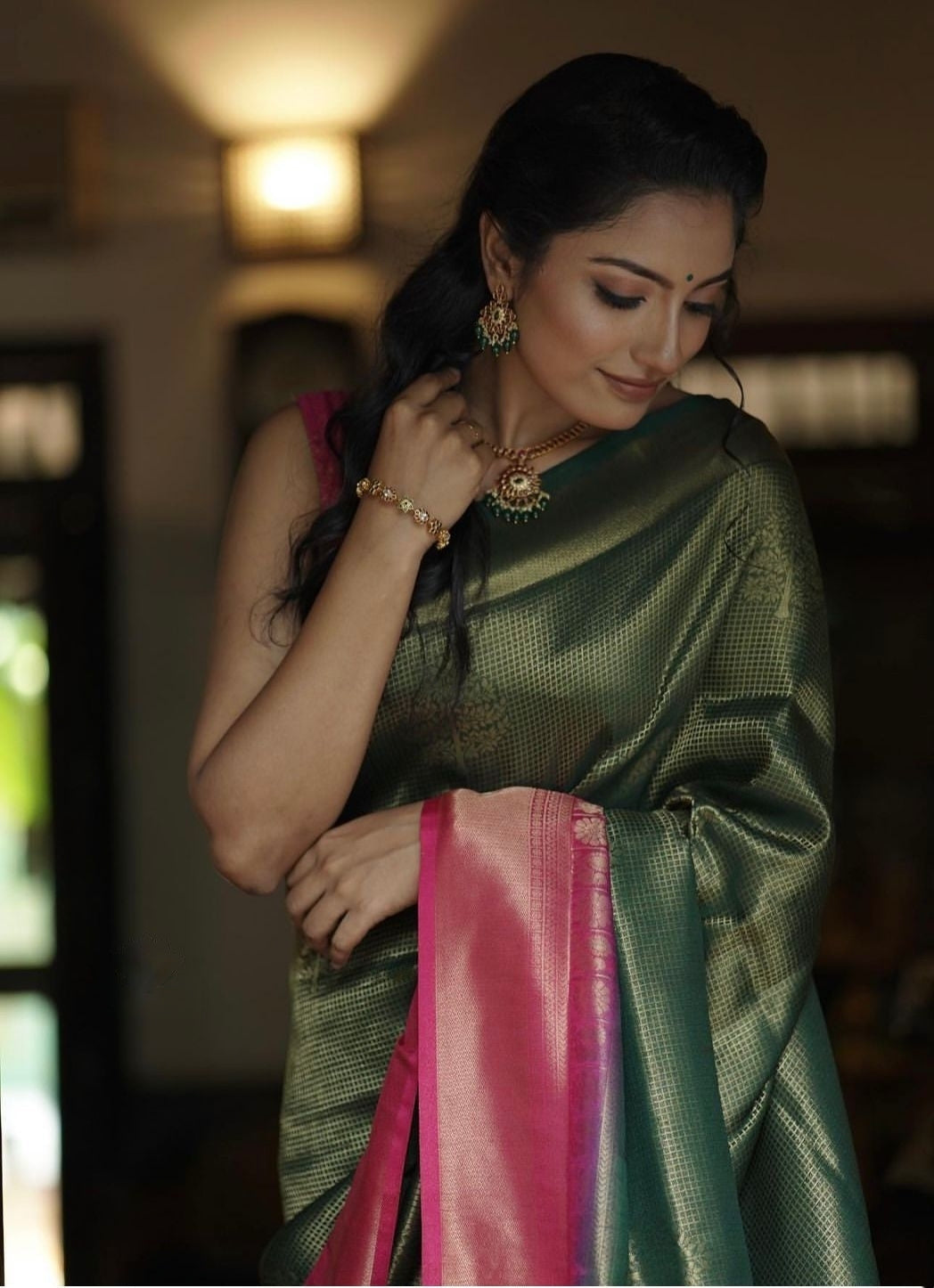 Extraordinary Dark Green Soft Silk Saree With Diaphanous Blouse Piece