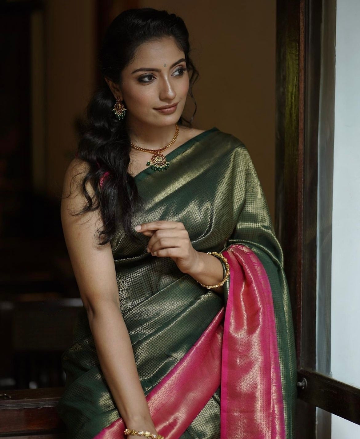 Extraordinary Dark Green Soft Silk Saree With Diaphanous Blouse Piece