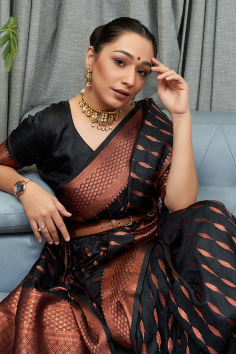 Surreptitious Black Soft Silk Saree With Ethnic Blouse Piece