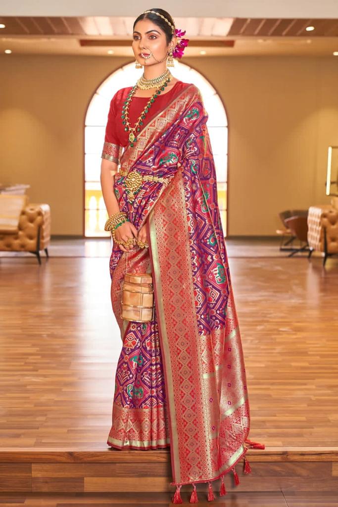 Pleasant Purple Patola Silk Saree with Nectarous Blouse Piece