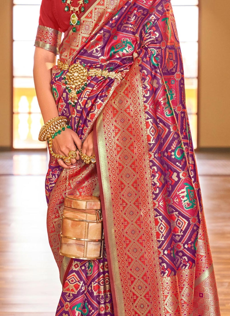 Pleasant Purple Patola Silk Saree with Nectarous Blouse Piece