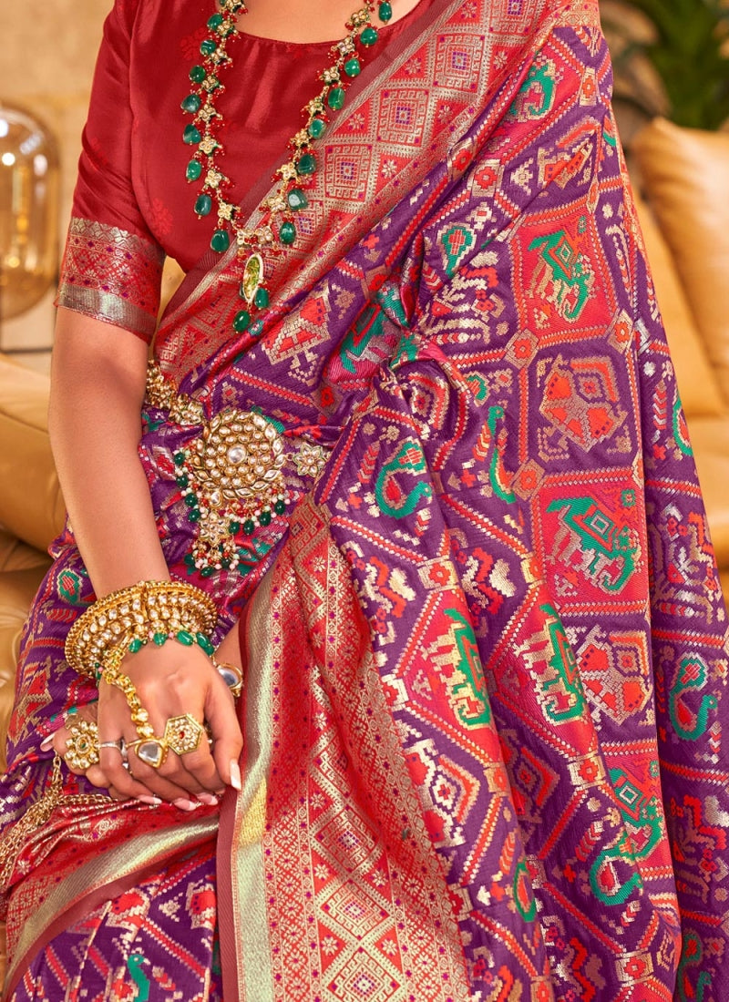 Pleasant Purple Patola Silk Saree with Nectarous Blouse Piece