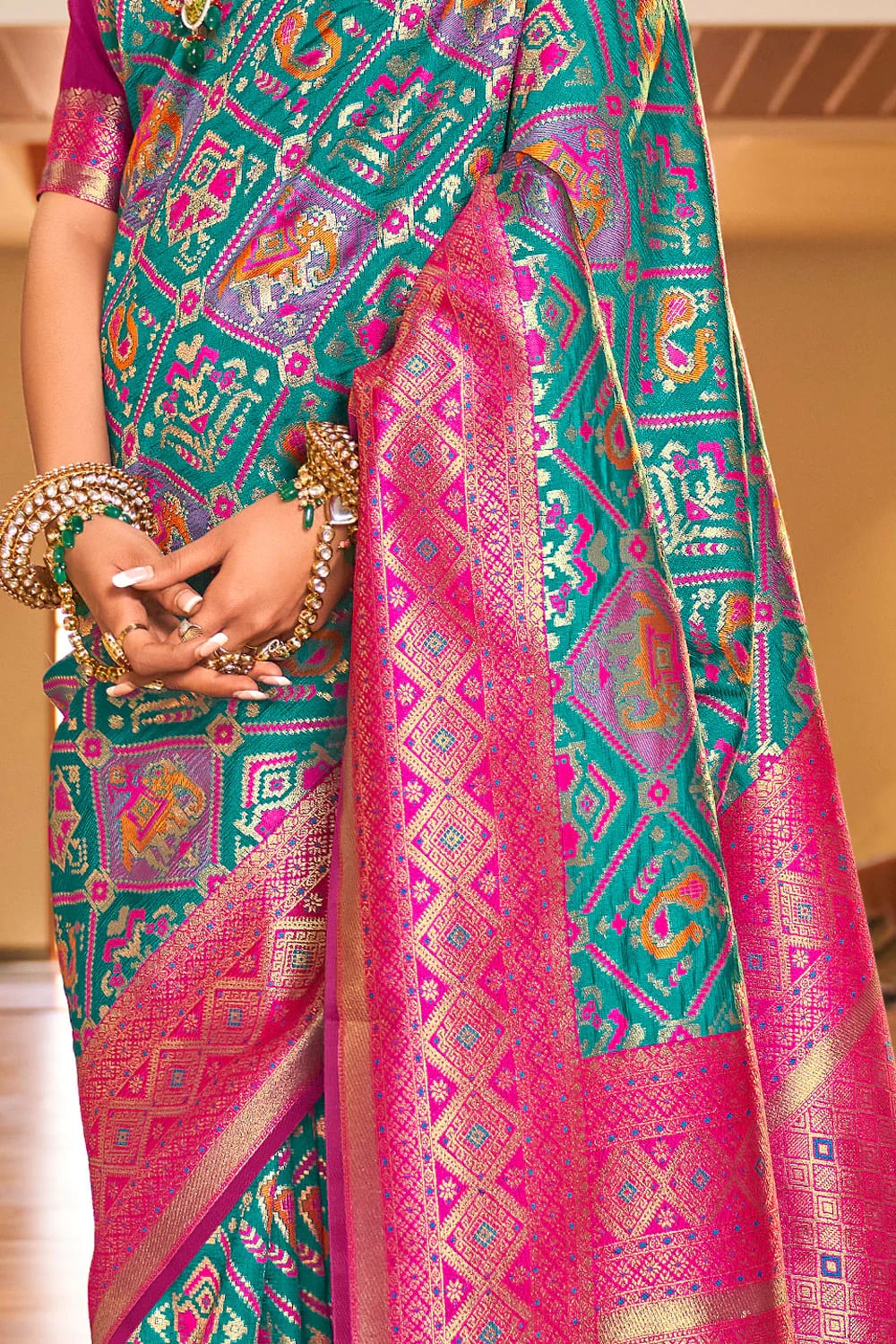 Desirable Turquoise Patola Silk Saree with Trendy Blouse Piece