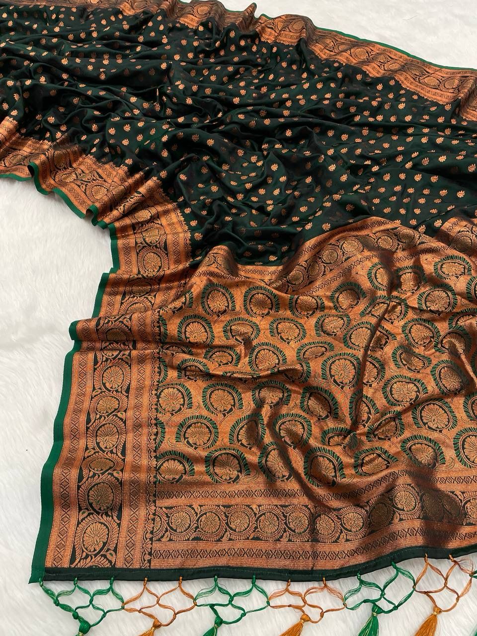 A glam Dark Green Soft Banarasi Silk Saree With Effulgent Blouse Piece