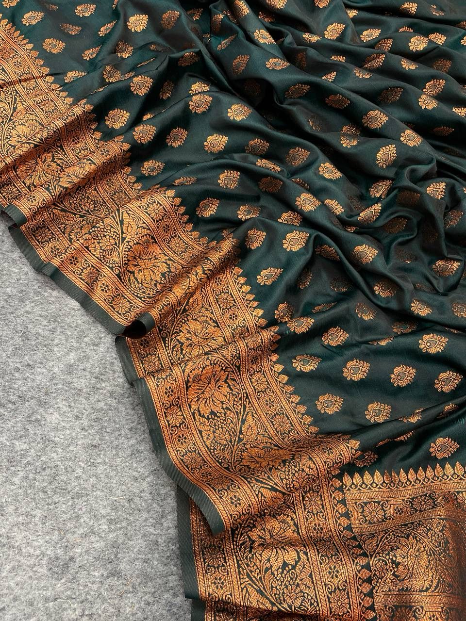 Denouement Dark Green Soft Banarasi Silk Saree With Luminous Blouse Piece